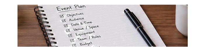 Notebook and laptop used for planning an event